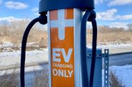 A ChargePoint electric car charging station sits in the parking lot of Garver Feed Mill in Madison, Wis., on Feb. 12, 2022. As a shift to electric vehicles appears increasingly inevitable, questions loom about who will control and benefit most from the transition. Jim Malewitz/Wisconsin Watch