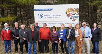 Baldwin at the future site for Memorial Hospital of Lafayette County with hospital leadership and local officials.