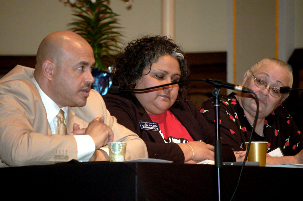 José Pérez sits next to fellow council member JoCasta Zamarripa during a forum regarding driver’s licenses for undocumented residents in 2015. File photo by Edgar Mendez/NNS.