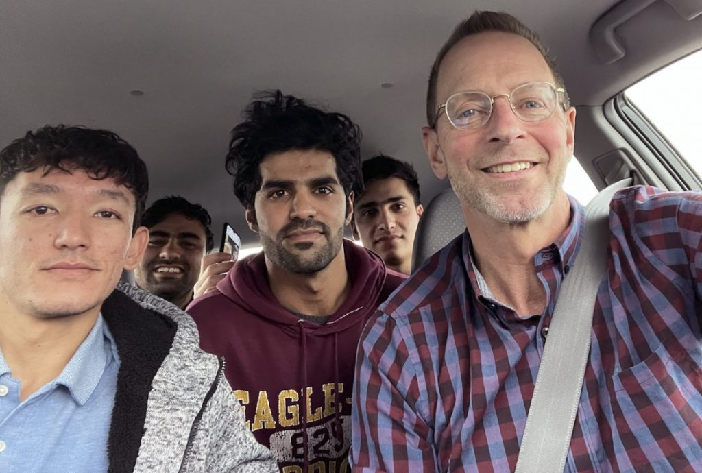 In February of 2022, Mike Ruminski drove four Afghan evacuees who live in the same Green Bay, Wisconsin duplex, after a Job Center of Wisconsin event. Ruminski teasingly calls the four mates “The Beatles.” Pictured from left are: Ali Akbar Gholami, Muddassir Saboory, Ahmad Samim Samimi and Fayaz Nabizada. (Courtesy of Mike Ruminksi)