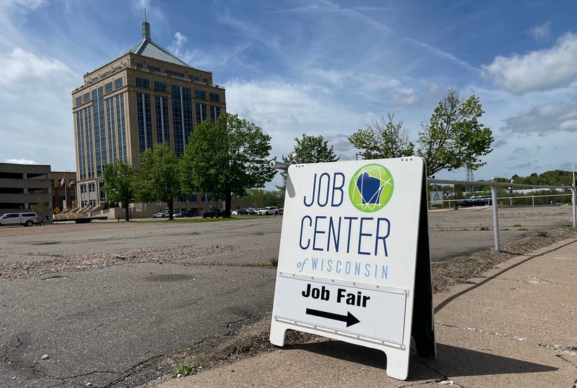 A sign advertises a job fair in Wausau, May 19, 2022. New data from the state show Wisconsin's unemployment rate remained at a historic low in April. Rob Mentzer/WPR