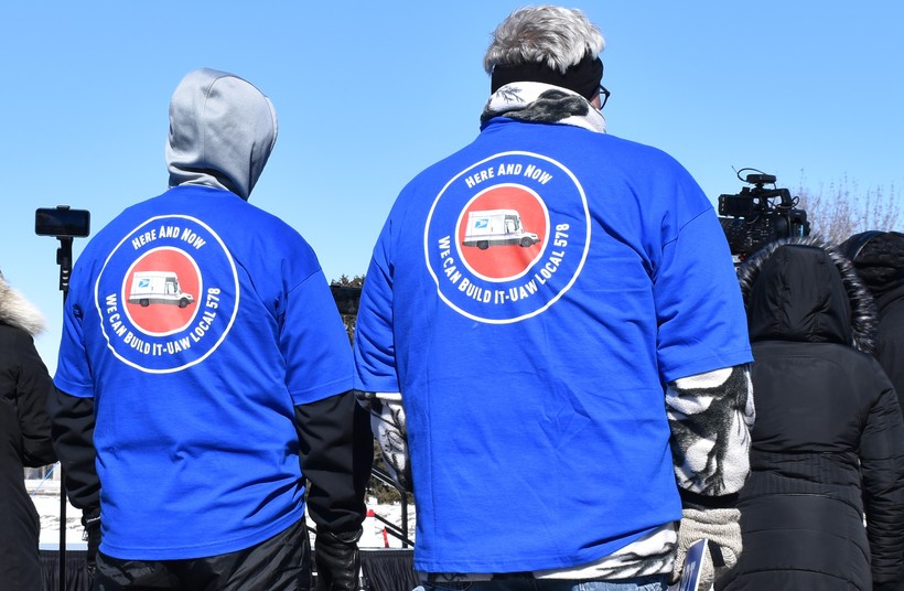 Union members' jackets call for the U.S. Postal Service's Next Generation Delivery Vehicle to be built by workers in Oshkosh. The workers participated in a protest outside Oshkosh Corp., February 26, 2022. Rob Mentzer/WPR