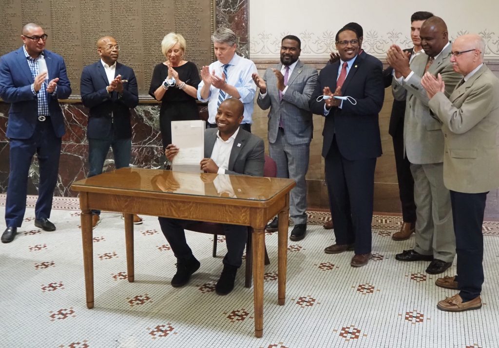 Mayor Cavalier Johnson displays a signed RNC framework agreement. Photo by Jeramey Jannene.