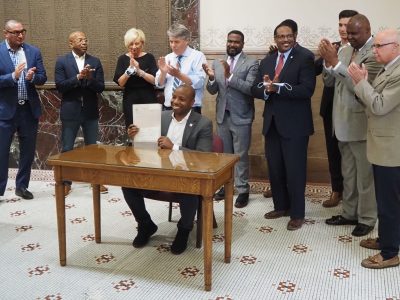 City Hall: Mayor Signs RNC Agreement To Applause