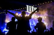 A fan lifts his arms as Jai Wolf performs a DJ set Thursday, Sept. 2, 2021, during Summerfest in Milwaukee, Wis. Angela Major/WPR