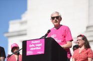Gov. Tony Evers addresses a crowd of protesters who oppose the Supreme Court’s draft ruling on Roe vs. Wade on Saturday, May 14, 2022, at the Wisconsin state Capitol in Madison, Wis. Angela Major/WPR