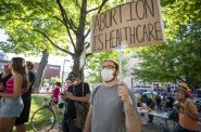 Jake Bodoh of Madison holds a sign during a protest for abortion access following the Supreme Court’s decision to overturn Roe vs. Wade on Friday, June 24, 2022, in Madison, Wis. Angela Major/WPR