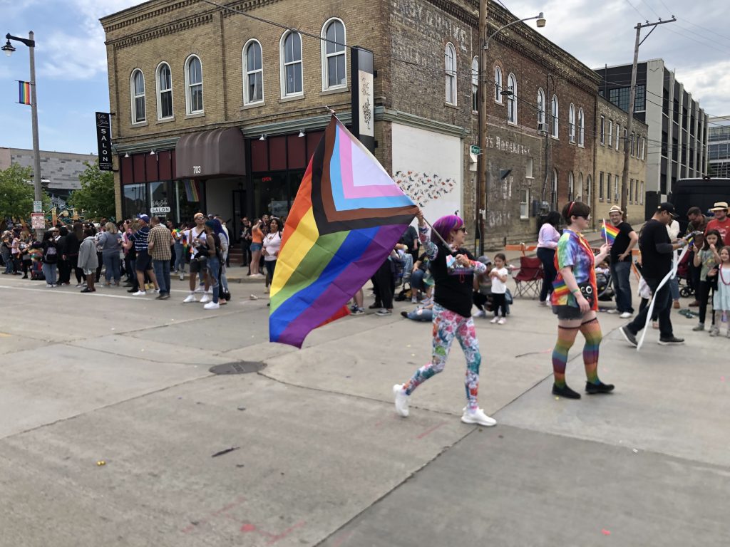 The Progress Pride flag being carried in the 2022 Milwaukee Pride Parade. Photo by Dave Reid.
