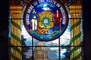 Great Seal of the State of Wisconsin. Stained glass window in the City Council chamber, Milwaukee City Hall. Photo by James Steakley, CC BY-SA 3.0 , via Wikimedia Commons