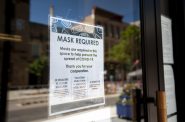 A sign hangs on the door of a business in downtown Madison on Wednesday, July 22, 2020. Angela Major/WPR