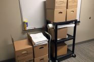 Boxes of documents procured through Wisconsin's open records law at the Wisconsin Department of Transportation offices. Bridgit Bowden/WPR