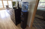 Jeff Lamont has a water dispenser in his Peshtigo, Wis., home due to PFAS contamination in the tap water. Angela Major/WPR