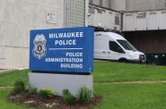 The Milwaukee Police Administration Building downtown. A surveillance van, or “critical response vehicle” is in the background. Photo by Isiah Holmes/Wisconsin Examiner.