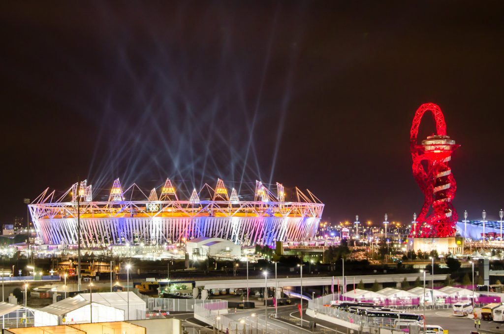 Olympic stadium and The Orbit during London Olympics opening ceremony. Photo by Alexander Kachkaev, CC BY 2.0 , via Wikimedia Commons