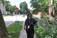 Freda Wright, a program manager for the Eras Senior Network, canvases Milwaukee’s Harambee neighborhood on July 20, 2022, connecting low-income elderly residents with free air conditioners and utility assistance. (Samantha McCabe / Wisconsin Watch)