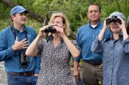 U.S. Sen. Tammy Baldwin watches white pelicans flying over Allouez Bay on Wisconsin Point on Aug. 19, 2022. Danielle Kaeding/WPR