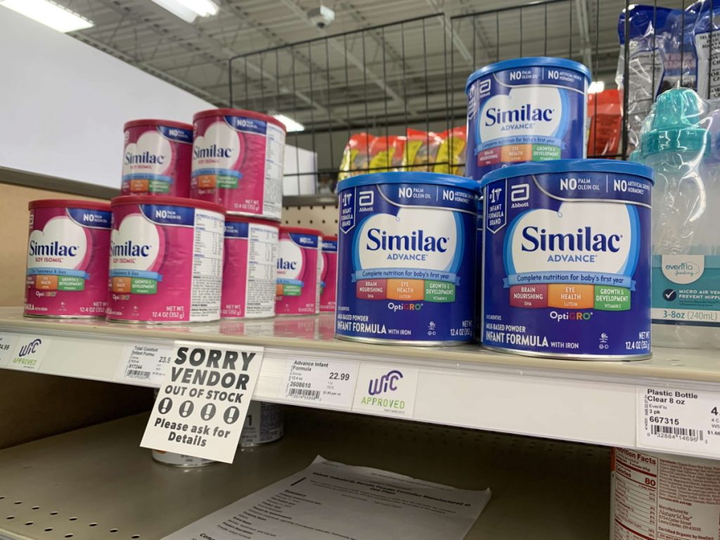 Similac formula is seen on the shelf at the Willy Street Co-op North grocery store in Madison, Wis., on Oct. 18, 2022. But a sign informs shoppers that the product Similac Total Comfort is out of stock. A nationwide baby formula shortage that stressed families for much of 2022 is easing in Wisconsin, but some caregivers are still struggling to find specialty formulas. (Coburn Dukehart/ Wisconsin Watch)