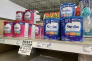 Similac formula is seen on the shelf at the Willy Street Co-op North grocery store in Madison, Wis., on Oct. 18, 2022. But a sign informs shoppers that the product Similac Total Comfort is out of stock. A nationwide baby formula shortage that stressed families for much of 2022 is easing in Wisconsin, but some caregivers are still struggling to find specialty formulas. (Coburn Dukehart/ Wisconsin Watch)