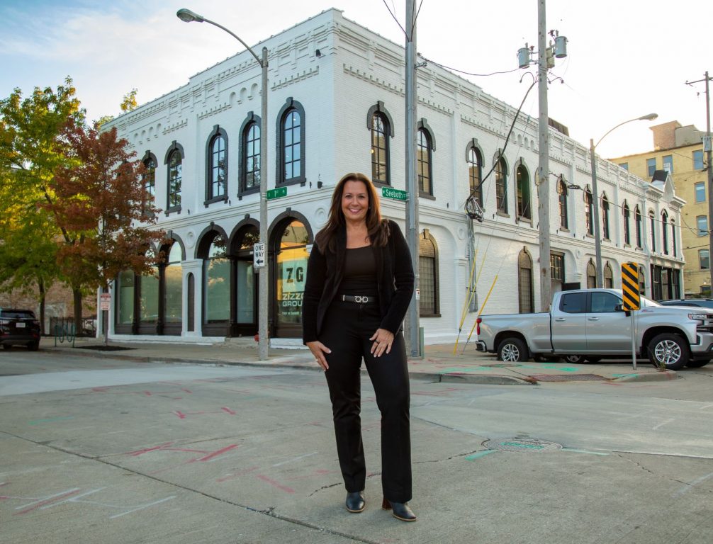 Anne Zizzo stands in front of new Zizzo Group headquarters. Photo provided.