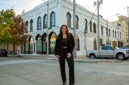 Anne Zizzo stands in front of new Zizzo Group headquarters. Photo provided.