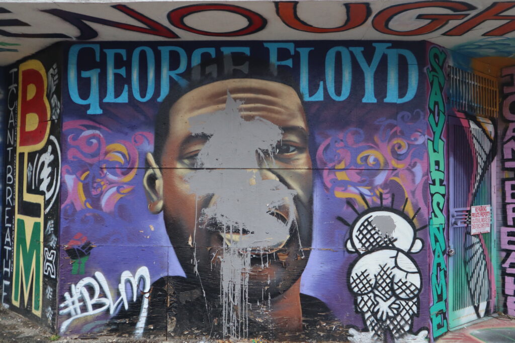 The George Floyd mural in Milwaukee, vandalized by an unknown person. Photo by Isiah Holmes/Wisconsin Examiner.