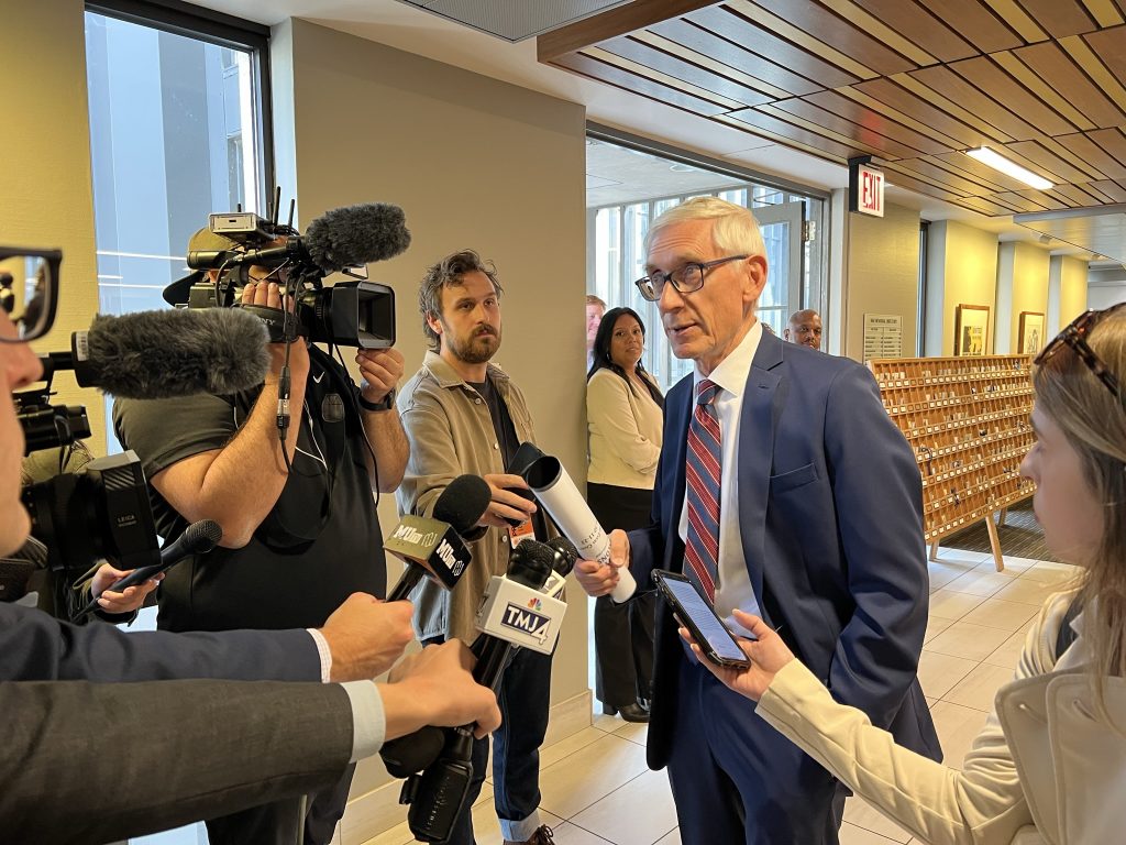 Governor Tony Evers in a media scrum on Oct. 11, 2022. Photo by Jeramey Jannene.