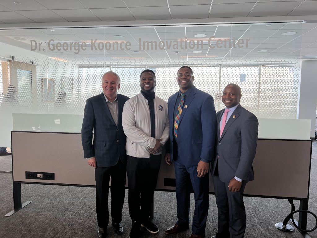 Church Mutual CEO Rich Poirier, LeRoy Butler, George Koonce and Mayor Cavalier Johnson in front of the Dr. George Koonce Innovation Center. Photo by Jeramey Jannene.