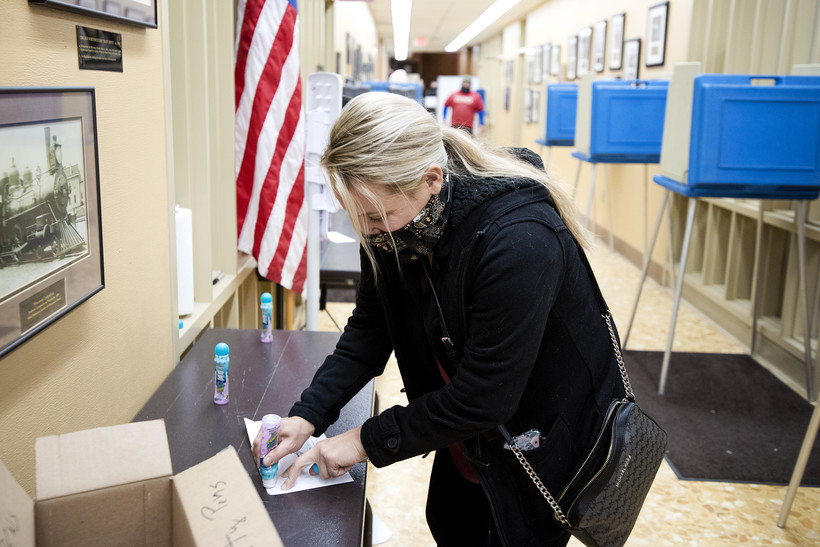 Lindsey Kreske votes early for the first time Wednesday, Oct. 28, 2020, at Waukesha City Hall. Angela Major/WPR
