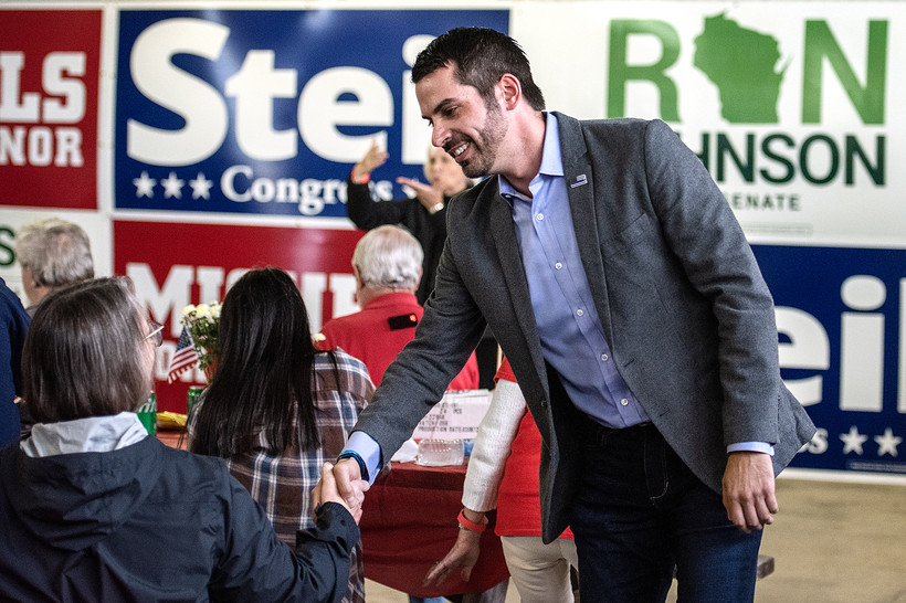 Republican attorney general candidate Eric Toney greets attendees during the 1st District GOP Fall Fest on Saturday, Sept. 24, 2022, at the Racine County Fairgrounds in Union Grove, Wis. Angela Major/WPR