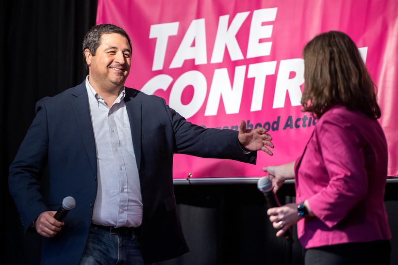 Attorney General Josh Kaul, left, greets lieutenant governor candidate Sara Rodriguez, right, during a campaign event Saturday, Oct. 8, 2022, in Middleton, Wis. Angela Major/WPR