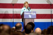 Sen. Tammy Baldwin speaks Saturday, Oct. 29, 2022, during a campaign event before the midterm elections at North Division High School in Milwaukee, Wis. Angela Major/WPR