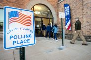 Voters enter a polling location as they open in the morning Tuesday, Nov. 8, 2022, before voting in the midterm elections at the Stoughton Fire Department in Stoughton, Wis. Angela Major/WPR