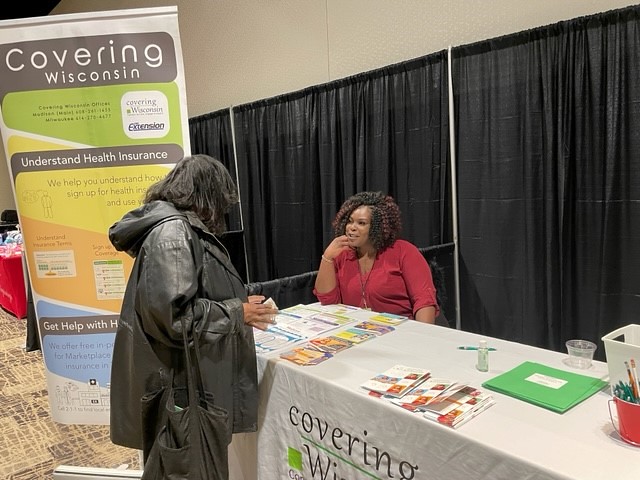 Quentella Perry, a lifelong Milwaukee resident and licensed health insurance navigator at Covering Wisconsin, answers basic questions about coverage and enrollment at a March 19 outreach event. Photo provided by Covering Wisconsin.