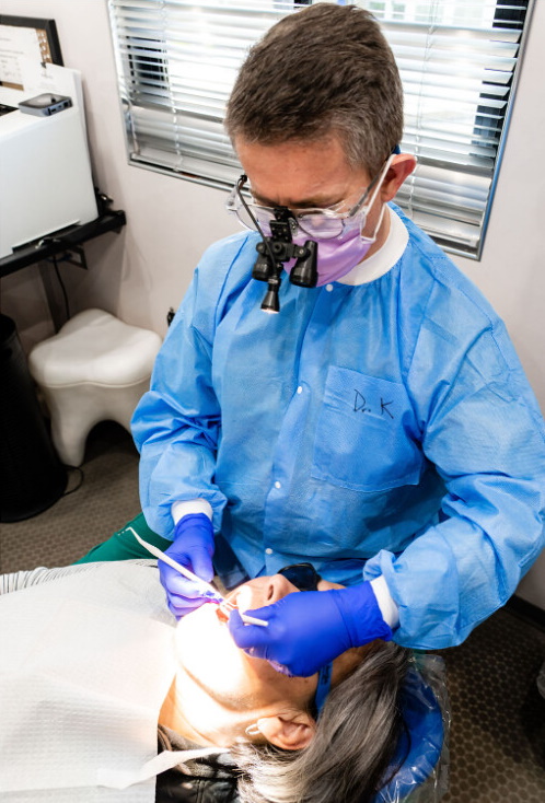 Charles Kosowski, dentist with Ascension Seton Dental Services, examines a patient. “I want their mouths to be the last thing they think about,” Kosowski said. (Photo provided by Ascension Seton Dental Services)