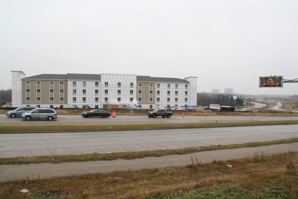 WoodSpring Suites hotel construction with Park Place and Interstate 41 in the background. Photo by Jeramey Jannene.