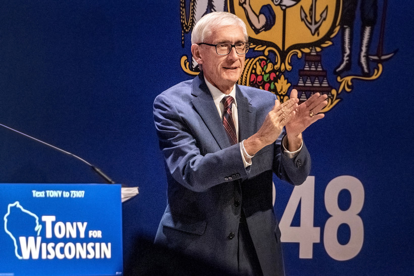 Gov. Tony Evers applauds as he gives his victory speech Tuesday, Nov. 8, 2022, at the Orpheum Theater in Madison, Wis. Angela Major/WPR