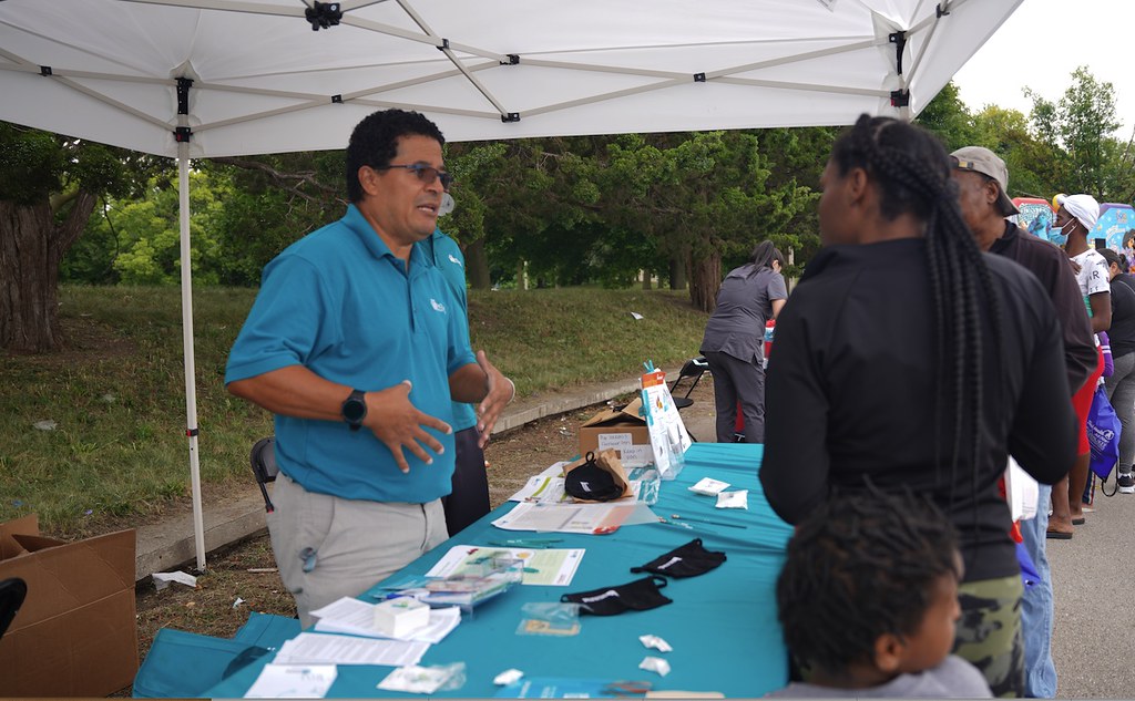 Javier Rivers of Molina Healthcare of Wisconsin answers questions at a community health and wellness resource fair in August, where 140 vaccines were ultimately administered. (Photo by Terrance Sims provided by INPOWER)