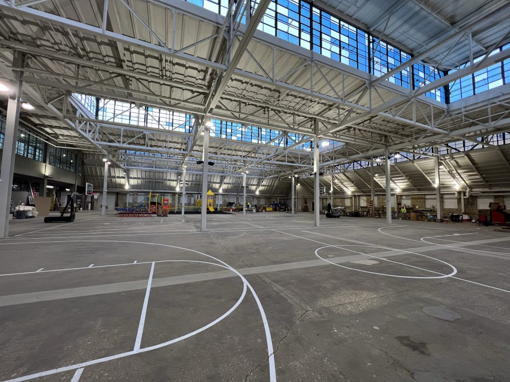 The partially-finished, indoor recreation space at The Community Within The Corridor. Photo by Jeramey Jannene.