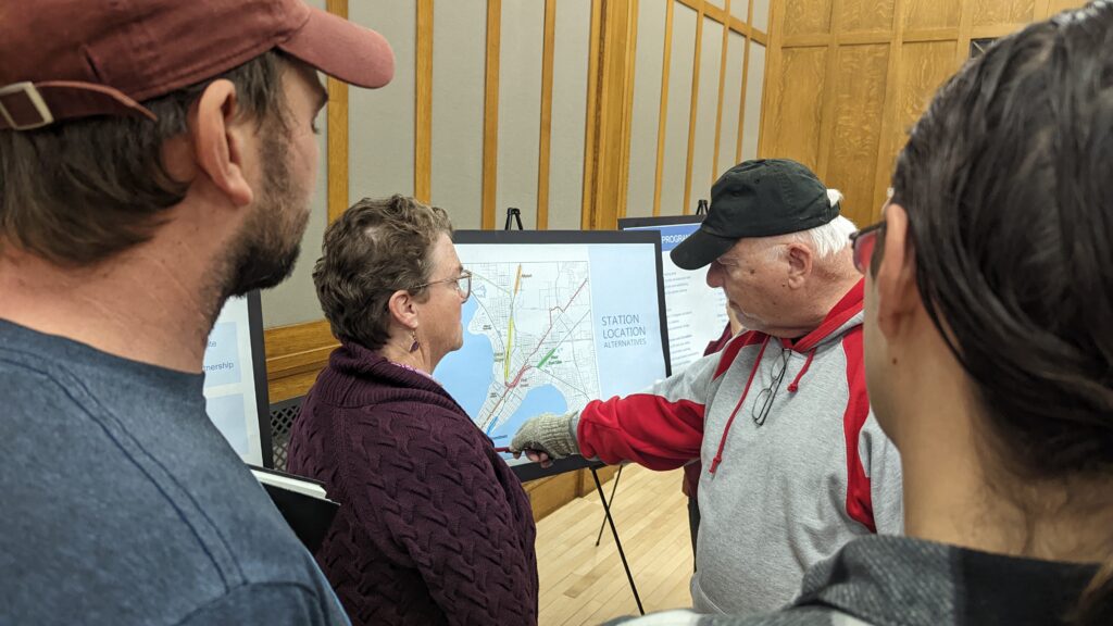 Residents discuss the potential Amtrak station locations at Madison’s passenger rail study kickoff meeting. Photo by Baylor Spears/Wisconsin Examiner.