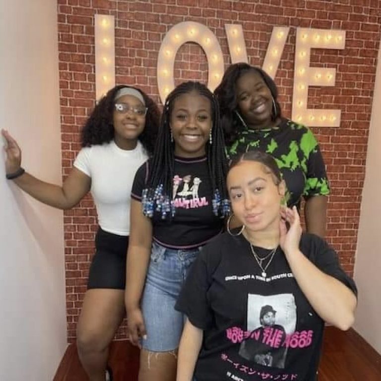 Jasmine Johnikin (top far right) and Sarah Smith (front right) hang out with their mentees, Faith Jones (far left) and Ayanna Lacking (middle). The team organizes hangout days to bring more fun and relaxation to the program. Photo provided by Jasmine Johnikin.