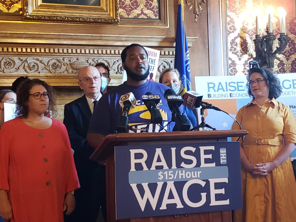 James Rudd speaks in favor of a bill to increase Wisconsin’s minimum wage at a Capitol press conference June 17, 2021, with Sen. Melissa Agard, right, the bill’s author. The legislation did not advance in the 2021-22 biennium. Photo by Erik Gunn/Wisconsin Examiner.