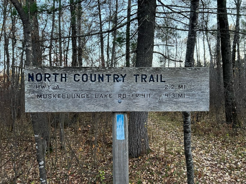 The North Country National Scenic Trail is marked with segment signs and blue blazes throughout it's 4,800-mile length across eight states. Photo by Mariah Quinn, courtesy of Brad Birkel