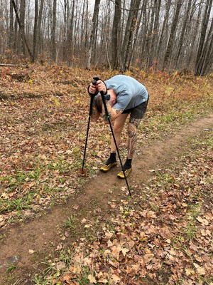 More than 200 miles into his North Country National Scenic Trail run, Brad Birkel's back was seizing up and he needed to take regular "pain breaks," occasionally stopping and putting his weight on his hiking poles. Photo by Matt Ivens, courtesy of Brad Birkel