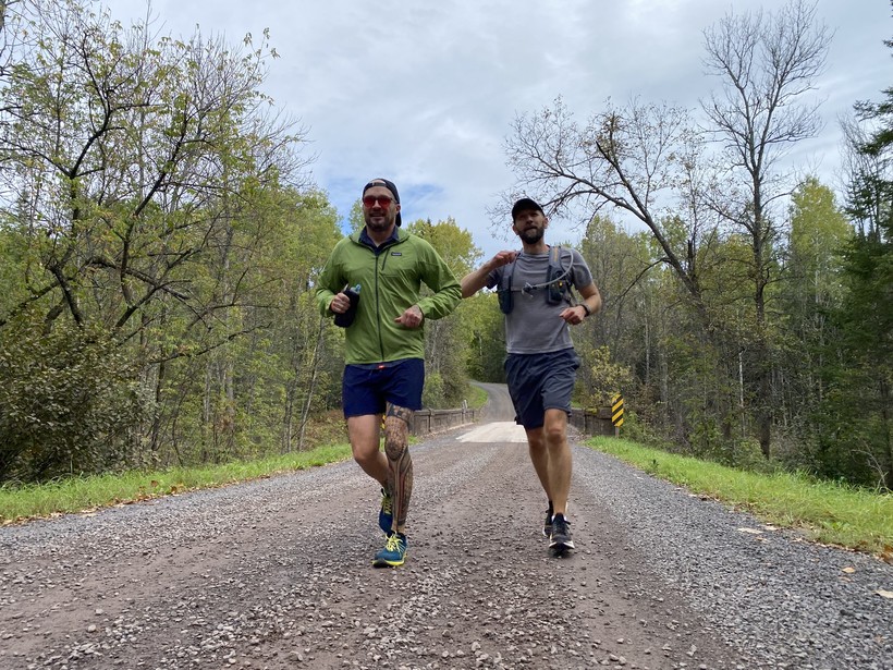 Brad Birkel, left, and crew member Matt Lawler run a road section of the North Country National Scenic Trail in western Wisconsin. Photo by Mariah Quinn, courtesy of Brad Birkel