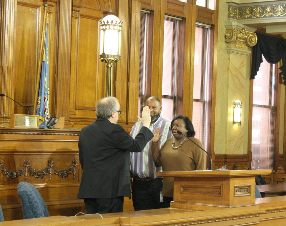 Jackie Q. Carter takes her oath of office from City Clerk Jim Owczarski alongside her husband Eddie Carter. Photo from Port Milwaukee.