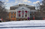 A student walks in front of Bascom Hall on the UW-Madison campus. Richard Hurd