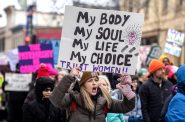 Protester Jana Goodman chants and holds up a sign during a march for abortion rights on the 50th anniversary of the Roe v. Wade ruling Sunday, Jan. 22, 2023, in Madison, Wis. Angela Major/WPR