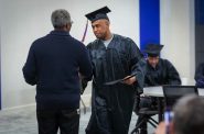 Hienok Demessie, a student who used a Second Chance Pell Grant, walks across the stage at a December 2022 graduation ceremony at the downtown campus of Milwaukee Area Technical College. Photo provided by Milwaukee Area Technical College.