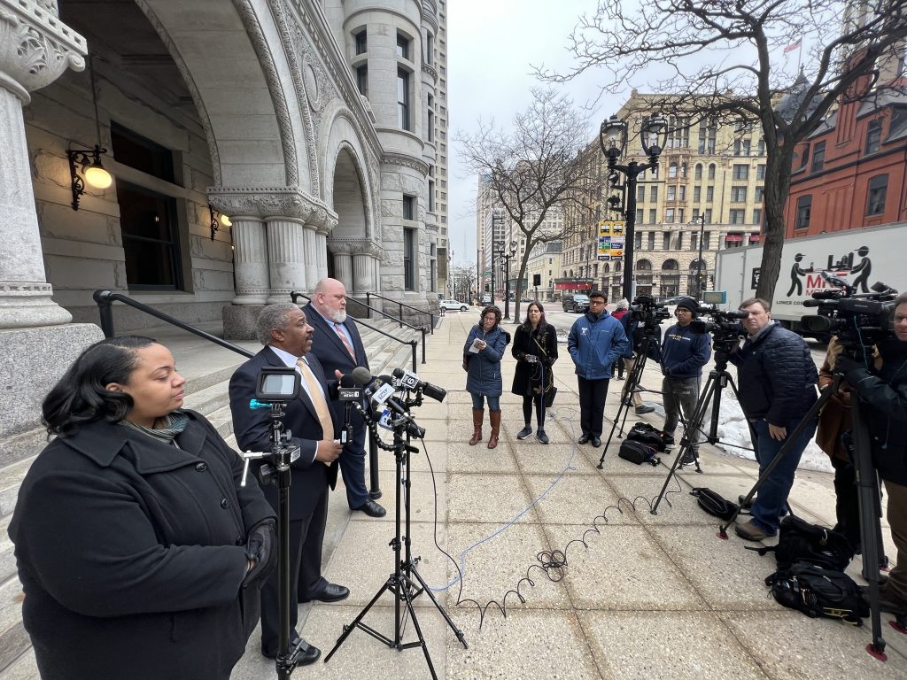 Alderwoman Milele A. Coggs (left), City Attorney Tearman Spencer (center) and deputy city attorney Robin A. Pederson (right) address reports on the steps of the Milwaukee Federal Courthouse. Photo by Jeramey Jannene.