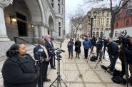 Alderwoman Milele A. Coggs (left), City Attorney Tearman Spencer (center) and deputy city attorney Robin A. Pederson (right) address reports on the steps of the Milwaukee Federal Courthouse. Photo by Jeramey Jannene.